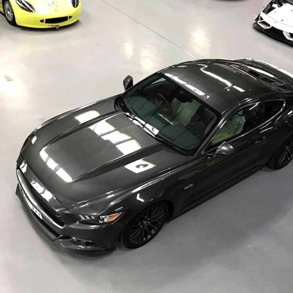 metallic grey mustang housed in topcats racing workshop