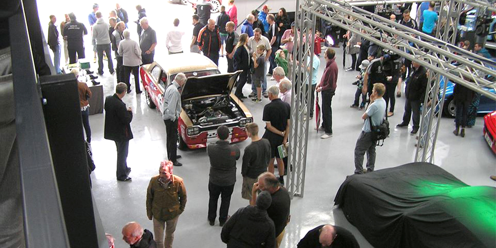 topcats racing hosting large event with attendees gathering around mark 1 escort