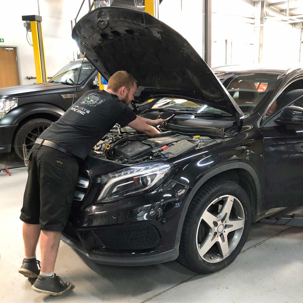 topcats team member working on mercedes road vehicle