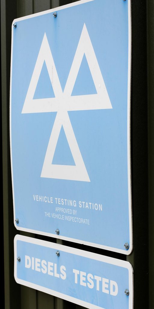 mot vehicle testing station sign at topcats racing workshop