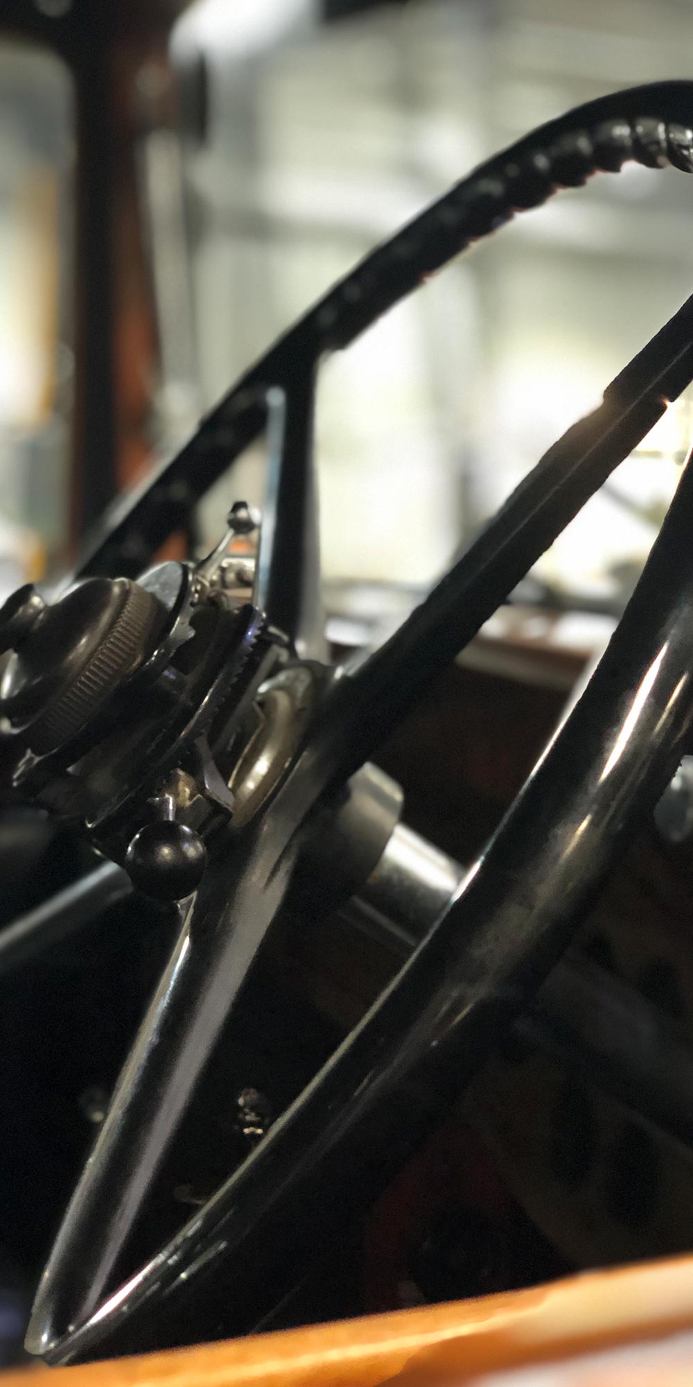 close up of rolls royce vintage steering controls at topcats racing workshop