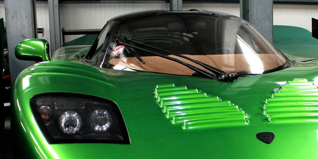 metallic green mosler mt900 at topcats racing workshop