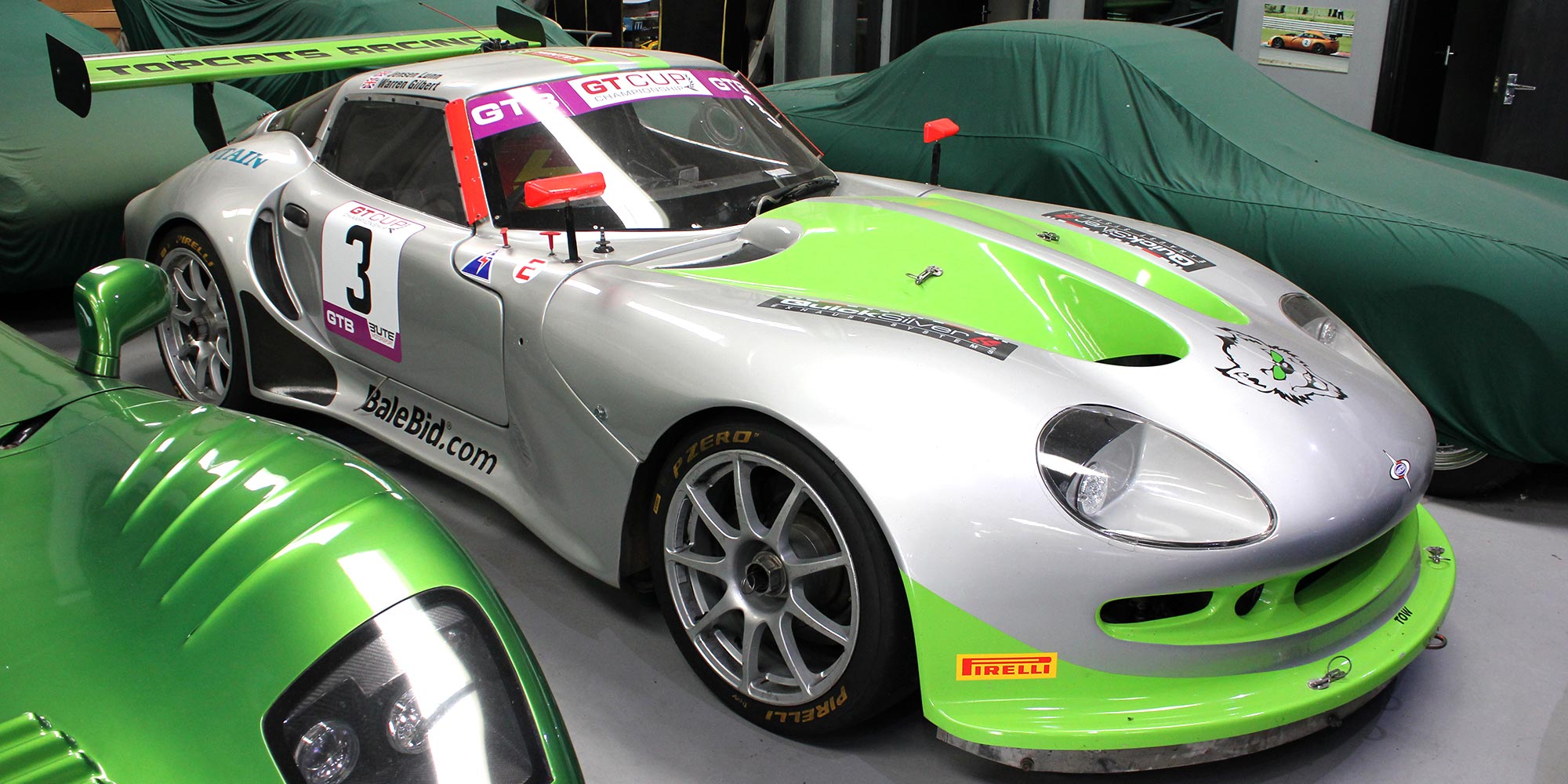 silver and green topcats racing marcos mantis performance car