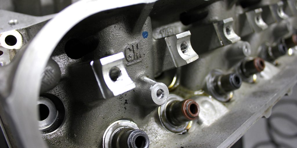 close up of cylinder head of v8 engine at topcats racing workshop