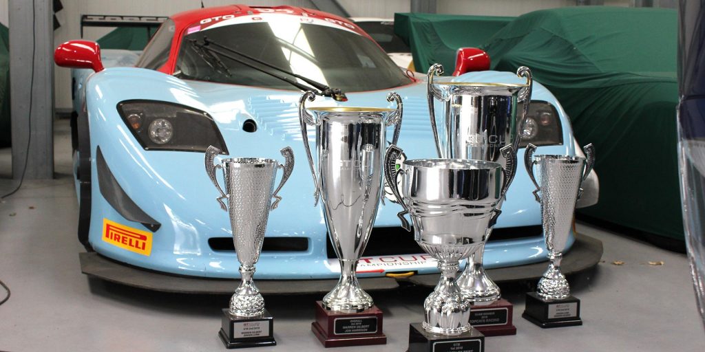 cluster of trophies in front of mosler mt900